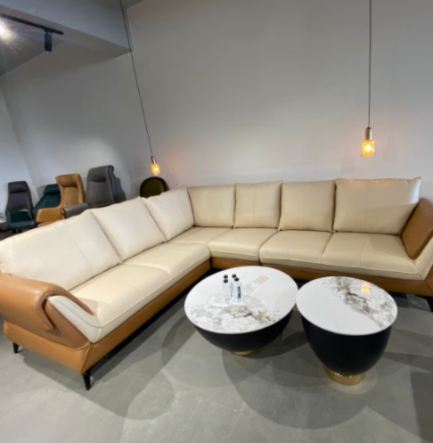 Beige sectional sofa with pendant lighting and dual round center tables